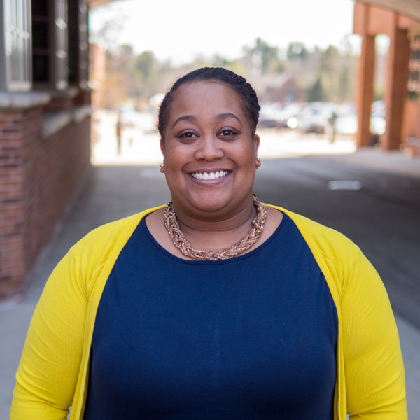 Tyra Sampson smiles and poses for a portrait.