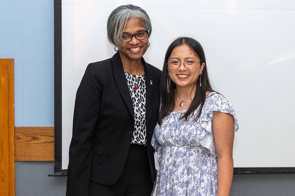 Two women smiling for a posed photo